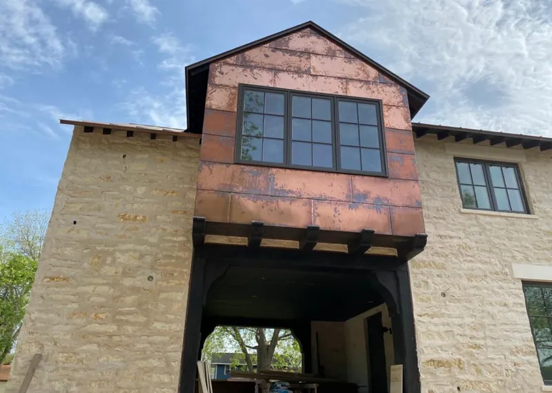 Copper metal panel facade on a stone building for Metal Roof Coating in Primera