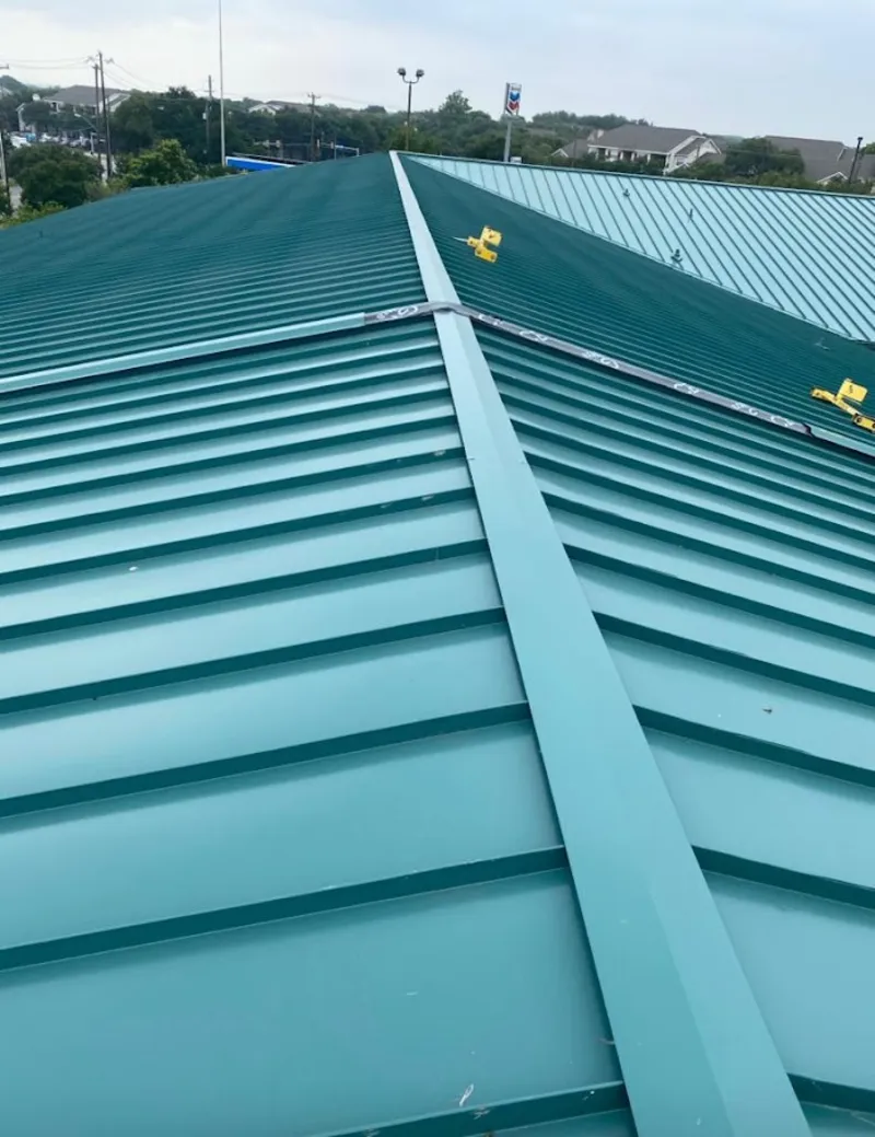 Green commercial metal roof ridge and valley for Metal Roof Repair in Primera
